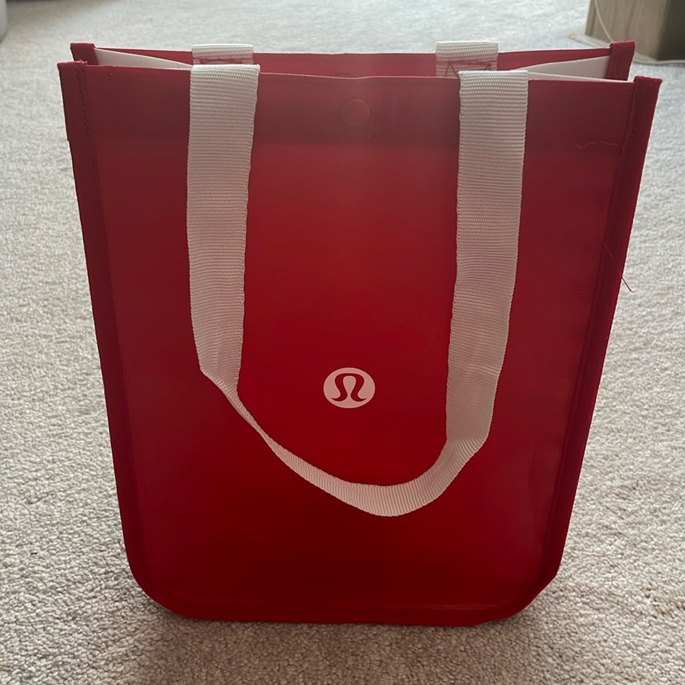 Classic red lululemon shopping bag with white strap